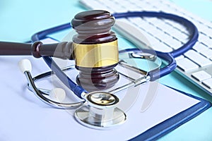 Gavel and stethoscope. medical jurisprudence. legal definition of medical malpractice. attorney. common errors doctors