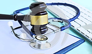 Gavel and stethoscope. medical jurisprudence. legal definition of medical malpractice. attorney. common errors doctors