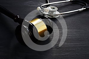 Gavel and stethoscope. Medical negligence concept. photo