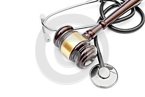 Gavel with stethoscope on white. Top view. Copy space. Medical law