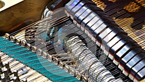 Gavel of the string open mechanism. Inside of a piano