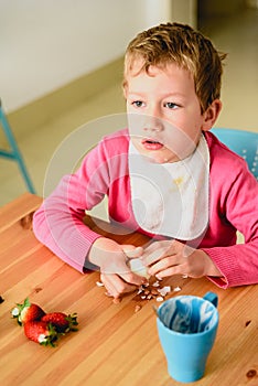 Gawking boy watching television during the meal