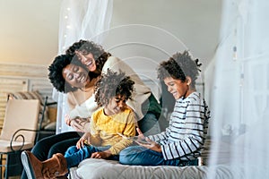 Gay couple children love happiness concept. Happy multiethnic family spending time together at home