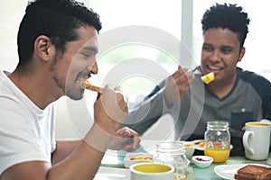 Gay Couple Eating Breakfast At Home In the Morning