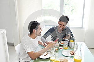 Gay Couple Eating Breakfast At Home In the Morning