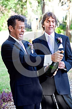 Gay Couple Opening Champagne