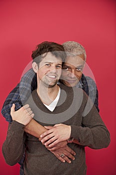 Gay couple on red background