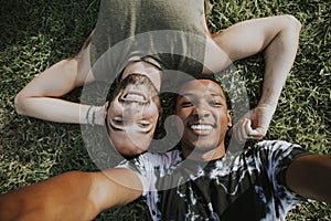 Gay couple relaxing in the grass