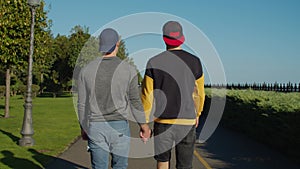 Gay couple at romantic date walking outdoors