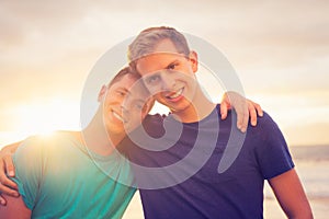 Gay couple watching sunset photo