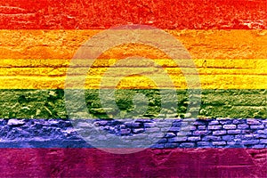 Gay flag painted on a brick wall, Rainbow background