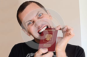 Gay holding a Russian passport