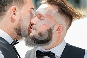 Gay kiss on wedding. Marriage gay couple tender kissing. Close up portrait of gay kissed. Gay couple wedding. Homosexual