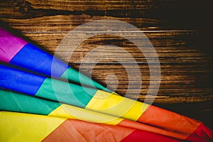 Gay pride flag on wooden table