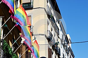 Gay pride flags hang on the building in Chueca district of Madrid photo
