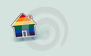 Gay pride rainbow in a silver home shape pin isolated on pastel green background. Copy space included. LGBTQ people right to live