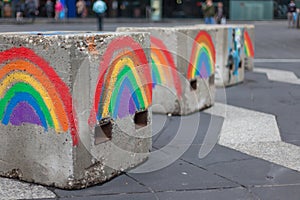 Gay pride rainbows painted on anti-terrorism concrete blocks