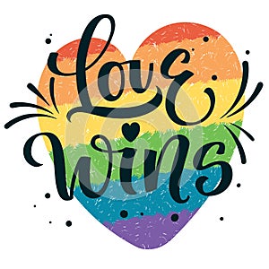 Gay Pride text Love Wins with splashes and dots decor on colorful gay rainbow heart background