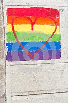 Gay rainbow flag and red heart