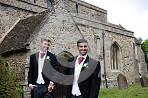 Gay wedding, grooms leave village church after being married to smiles and confetti