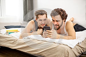 Gays watching interesting videos on mobile phone