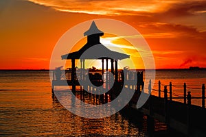 Gazebo bridge sea at sunset