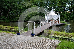 A gazebo built on the water. Covered place for meetings and feasts at a small stake