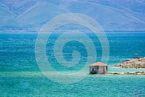 Gazebo by Coast of clear Sevan Lake in Armenian mountains, Armenia, Asia