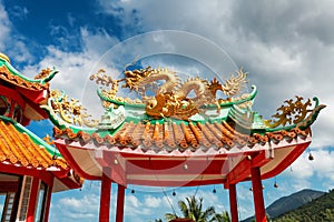 gazebo with a golden dragon on the roof of Chinese Sangthom Temple of the Goddess of Mercy Shrine in Chaloklum, Ko Pha Ngan, Thail