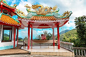 gazebo with a golden dragon on the roof of Chinese Sangthom Temple of the Goddess of Mercy Shrine in Chaloklum, Ko Pha Ngan, Thail