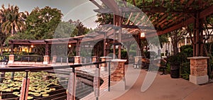 Gazebo overlooking a pond and fountain at sunset at the Garden o
