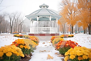 gazebo in park with frostbitten flowerbeds