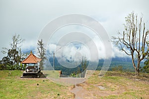 The gazebo stands on a cloud-shrouded mountain on the popular tourist island of Bali