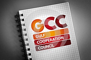 GCC - Gulf Cooperation Council acronym on notepad, business concept background