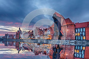 Gdansk beautiful sunset, view on Zuraw port crane and medieval facades, Poland