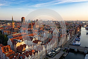 Gdansk is a city in Poland. Gdansk in the morning rays, the sun is reflected from the roofs of the old city.