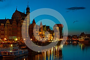 Gdansk cityscape with medieval port, Zuraw crane and Motlawa river at night, Poland photo
