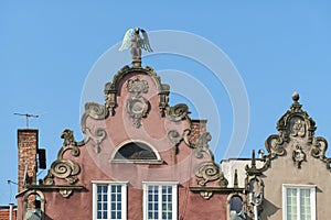 Gdansk - A close up of the facades of tall building in the middle of Old Town in Poland. The buildings have many bright colors