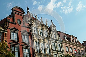 Gdansk - A close up of the facades of tall building in the middle of Old Town in Poland. The buildings have many bright colors