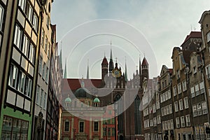 Gdansk - A close up of the facades of tall building in the middle of Old Town in Poland. The buildings have many bright colors