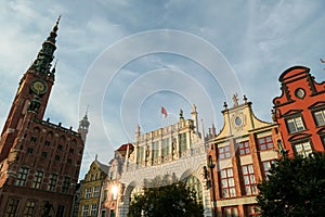 Gdansk - A close up of the facades of tall building in the middle of Old Town in Poland. The buildings have many bright colors