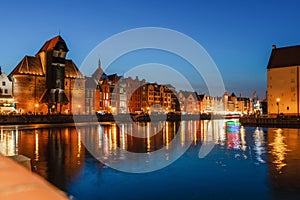 Gdansk night city riverside view. View on famous crane and facades of old medieval houses