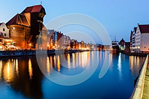 Gdansk night city riverside view. View on famous crane and facades of old medieval houses