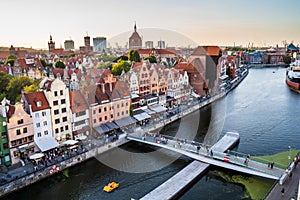 Gdansk, North Poland -Panoramic aerial shot of Motlawa river embankment in Old Town during sunset where people