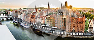 Gdansk, North Poland - August 13, 2020: Wide angle panoramic aerial shot of Motlawa river embankment in Old Town during sunset in