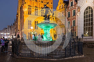 Fountain of the Neptune in Old Town of Gdansk at night. Poland