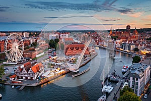 Gdansk, Poland - July 4, 2022: Beautiful architecture of the Main Town of Gdansk over the Motlawa River at sunset, Poland