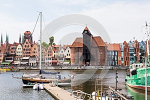 Gdansk, Poland - Juny, 2019. Gdansk old town and famous crane, Polish Zuraw. View from Motlawa river. The city also known as