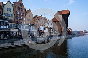 Gdansk Poland March 2022 beautiful old town over Motlawa river. The Zuraw Crane and colorful gothic facades of the old