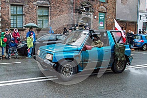 Men in military uniform inside car at National Independence Day in Gdansk in Poland. Celebrates 99th anniversary of independence.